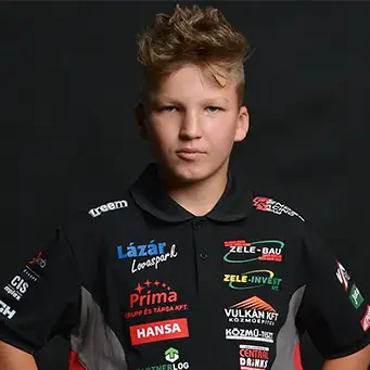 Tamás Gender Jr posing in front of a black background, his shirt showing the logos of his sponsors